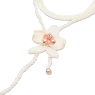 orquídea blanca bolas rosas